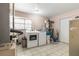 Laundry room with washer, dryer, and ample storage shelving at 470 Ridgecrest Dr, Punta Gorda, FL 33982