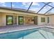 Enjoy the view of the kitchen from this relaxing pool area at 9437 Galaxie Cir, Port Charlotte, FL 33981