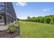 Expansive grassy backyard with lush landscaping at 9437 Galaxie Cir, Port Charlotte, FL 33981
