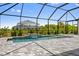 Relaxing pool and spa with a screened enclosure and water feature at 9445 Galaxie Cir, Port Charlotte, FL 33981