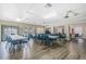 Spacious community room with tables and chairs at 25100 Sandhill Blvd # Y201, Punta Gorda, FL 33983