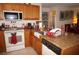Kitchen with granite countertops, oak cabinets, and island at 25100 Sandhill Blvd # Y201, Punta Gorda, FL 33983