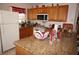 Fully equipped kitchen with granite countertop and wood cabinets at 25100 Sandhill Blvd # Y201, Punta Gorda, FL 33983
