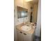 Clean bathroom with a large vanity mirror at 25100 Sandhill Blvd # Y201, Punta Gorda, FL 33983