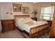 Cozy bedroom with wood-framed bed and nightstands at 25100 Sandhill Blvd # Y201, Punta Gorda, FL 33983
