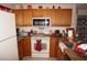 Bright kitchen features granite countertops and oak cabinets at 25100 Sandhill Blvd # Y201, Punta Gorda, FL 33983