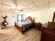 Bedroom with king-size bed and ceiling fan at 3106 Harbor Blvd # 3A, Port Charlotte, FL 33952