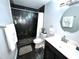 Updated bathroom with dark tile, a large vanity, and a walk-in shower at 3106 Harbor Blvd # 3A, Port Charlotte, FL 33952