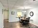 Charming dining area with a round table and four chairs, near kitchen at 3106 Harbor Blvd # 3A, Port Charlotte, FL 33952