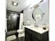 Updated bathroom with dark tile, a large vanity, and a walk-in shower at 3106 Harbor Blvd # 3A, Port Charlotte, FL 33952