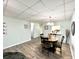Simple dining area with four chairs and a view into the kitchen at 3106 Harbor Blvd # 3A, Port Charlotte, FL 33952