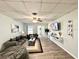 Living Room with gray sofa, coffee table, and hardwood floors at 3106 Harbor Blvd # 3A, Port Charlotte, FL 33952