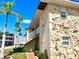 Two-story building with stone exterior and palm trees at 3106 Harbor Blvd # 3A, Port Charlotte, FL 33952
