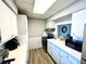 Modern kitchen with white cabinets, stainless steel appliances, and quartz countertops at 3106 Harbor Blvd # 3A, Port Charlotte, FL 33952
