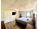 Spacious bedroom with a king-size bed and large TV at 3106 Harbor Blvd # 3A, Port Charlotte, FL 33952