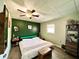 Spacious bedroom with king-size bed and ceiling fan at 3106 Harbor Blvd # 3A, Port Charlotte, FL 33952