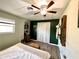 Bright bedroom featuring a queen-size bed and built-in closet at 3106 Harbor Blvd # 3A, Port Charlotte, FL 33952