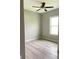 Simple bedroom with ceiling fan and light fixture at 2563 Longworthy Rd, North Port, FL 34288