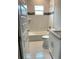 Bathroom with white tile and granite countertop at 2563 Longworthy Rd, North Port, FL 34288