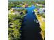 Aerial view of homes and canal in a residential area at 13654 Allamanda Cir, Port Charlotte, FL 33981