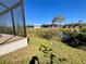 Backyard with a view of the lake at 13654 Allamanda Cir, Port Charlotte, FL 33981