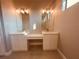 Double vanity bathroom with modern light fixtures and spacious countertops at 13654 Allamanda Cir, Port Charlotte, FL 33981