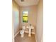 Modern single vanity bathroom with pedestal sink and toilet at 13654 Allamanda Cir, Port Charlotte, FL 33981