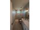 Beautiful bathroom with a walk-in shower, stone pebble floor, and a modern vanity at 13654 Allamanda Cir, Port Charlotte, FL 33981