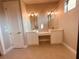 Double vanity bathroom with modern light fixtures and spacious countertops at 13654 Allamanda Cir, Port Charlotte, FL 33981