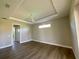 Main bedroom with high ceilings, a ceiling fan and wood flooring at 13654 Allamanda Cir, Port Charlotte, FL 33981