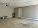 Interior view of a garage with a door to the house and a water heater at 13654 Allamanda Cir, Port Charlotte, FL 33981