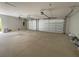 Spacious two-car garage with automatic door openers and ample storage space at 13654 Allamanda Cir, Port Charlotte, FL 33981