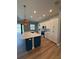 Kitchen featuring stainless appliances, a center island and modern lighting at 13654 Allamanda Cir, Port Charlotte, FL 33981