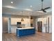 Spacious kitchen with stainless appliances, a center island and modern lighting at 13654 Allamanda Cir, Port Charlotte, FL 33981