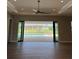 Open living space with sliding glass doors that open to a private pool at 13654 Allamanda Cir, Port Charlotte, FL 33981