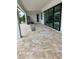 Large covered patio with tile flooring and access to the backyard at 13654 Allamanda Cir, Port Charlotte, FL 33981