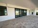 Spacious covered patio with tile flooring and sliding glass doors at 13654 Allamanda Cir, Port Charlotte, FL 33981