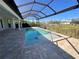 Relaxing pool area with covered patio and paver deck at 13654 Allamanda Cir, Port Charlotte, FL 33981