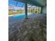 Relaxing screened-in pool with paved patio and tranquil view at 13654 Allamanda Cir, Port Charlotte, FL 33981