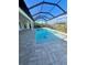 Refreshing screened-in pool with paved patio and gorgeous view at 13654 Allamanda Cir, Port Charlotte, FL 33981