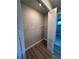 Walk-in closet with wire shelving and wood-look floors at 13654 Allamanda Cir, Port Charlotte, FL 33981