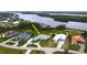 Aerial view of the home with a spacious yard, located on the water at 2033 Treasure Ln, Punta Gorda, FL 33982