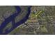 Aerial view of land for sale, surrounded by water and lush greenery at 2033 Treasure Ln, Punta Gorda, FL 33982
