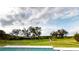 Spacious backyard with lush green grass and a water view at 2033 Treasure Ln, Punta Gorda, FL 33982