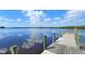 Wooden dock with gorgeous river views and clear, blue skies at 2033 Treasure Ln, Punta Gorda, FL 33982
