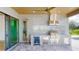Outdoor kitchen with stainless steel appliances and bar area, perfect for entertaining at 2033 Treasure Ln, Punta Gorda, FL 33982