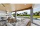 Relaxing poolside patio area furnished with comfortable seating at 2033 Treasure Ln, Punta Gorda, FL 33982