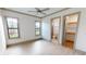 Bright bedroom with wood-look floors, en-suite bathroom and walk-in closet at 2033 Treasure Ln, Punta Gorda, FL 33982