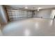 Large garage with epoxy flooring and two garage doors at 2033 Treasure Ln, Punta Gorda, FL 33982