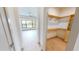 Large walk-in closet with ample shelving and hanging space at 2033 Treasure Ln, Punta Gorda, FL 33982